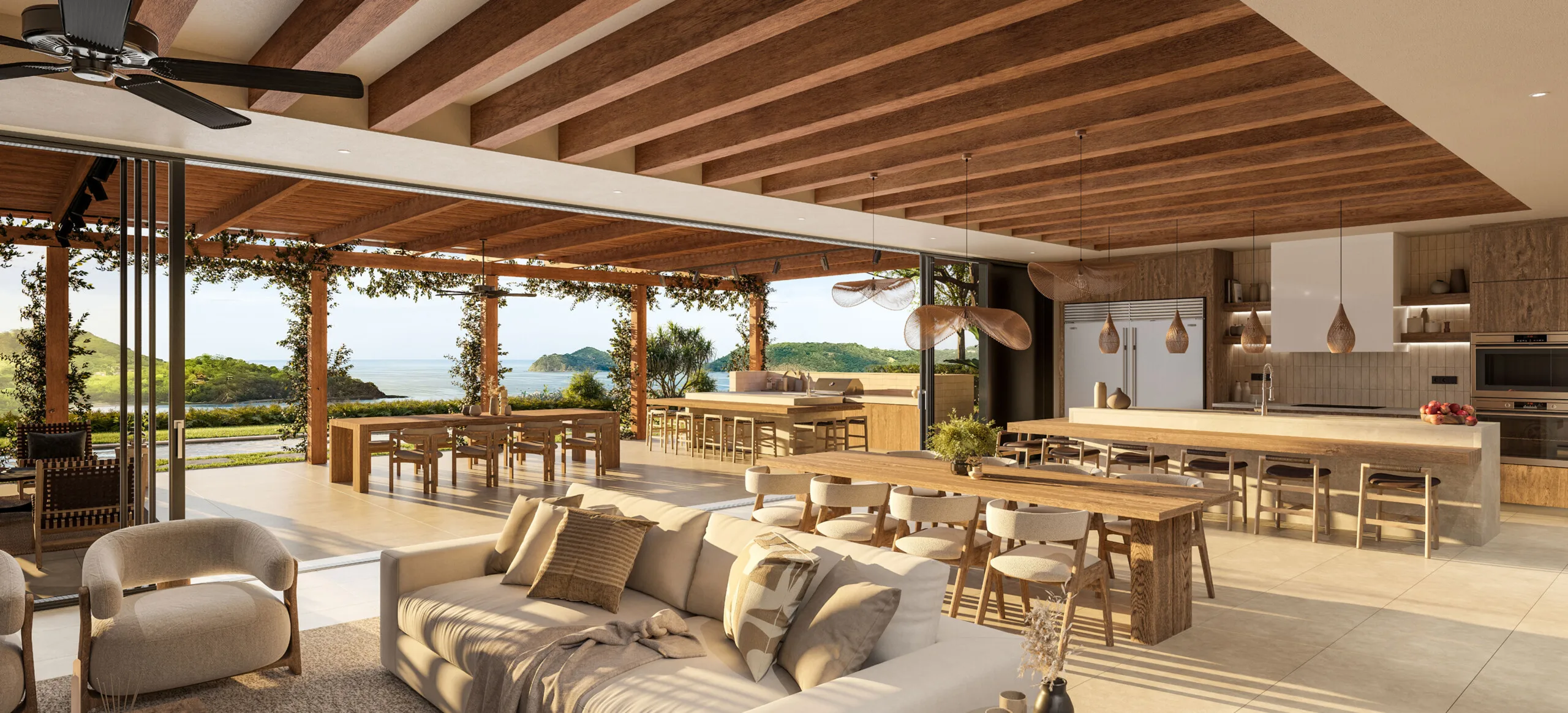 Gourmet open-concept kitchen and living area at Casa Uno featuring warm wood-beam ceilings and seamless terrace access